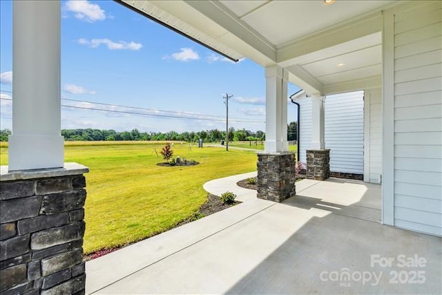 view of yard featuring covered porch