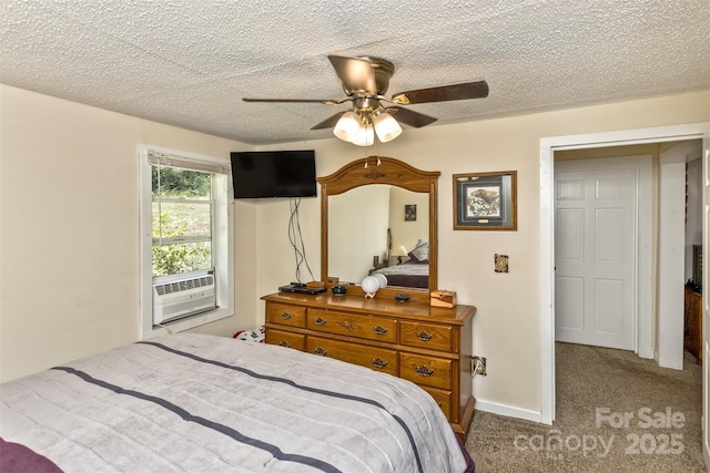 carpeted bedroom featuring ceiling fan, cooling unit, and a textured ceiling