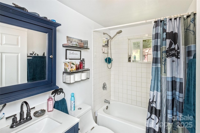 full bathroom featuring shower / tub combo, vanity, and toilet