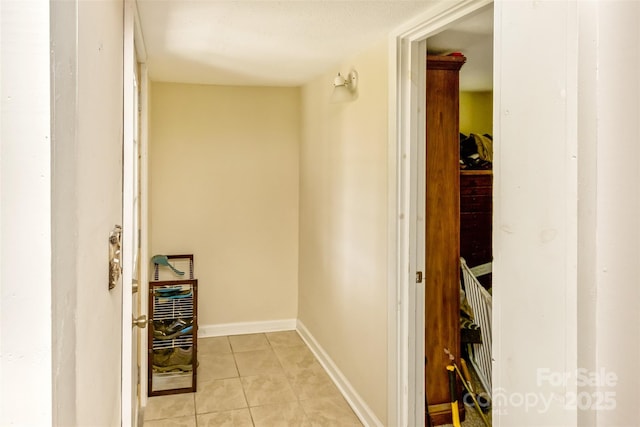 hall with light tile patterned flooring