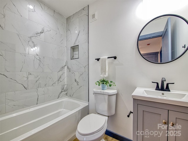 full bathroom featuring toilet, bathing tub / shower combination, and vanity