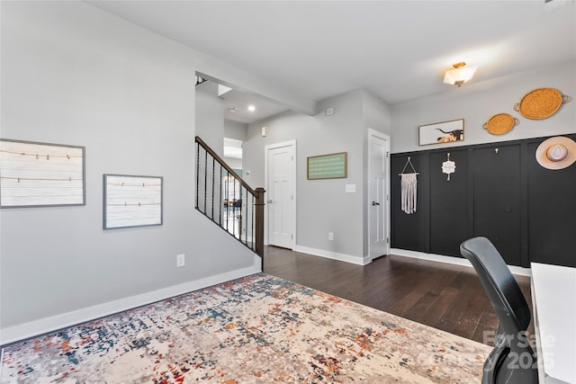 foyer entrance with dark wood-type flooring