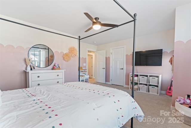 bedroom with ceiling fan and light colored carpet