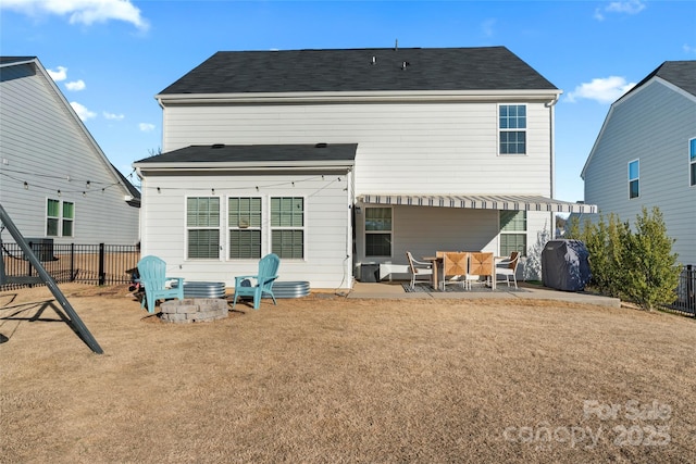 back of property with outdoor lounge area, a lawn, and a patio