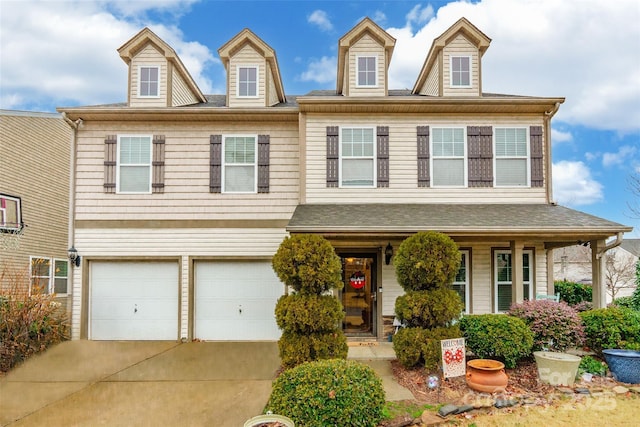 view of front of home with a porch and a garage