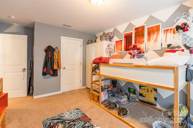 bedroom featuring light colored carpet