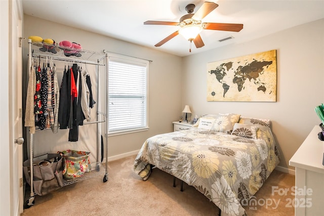 carpeted bedroom featuring ceiling fan