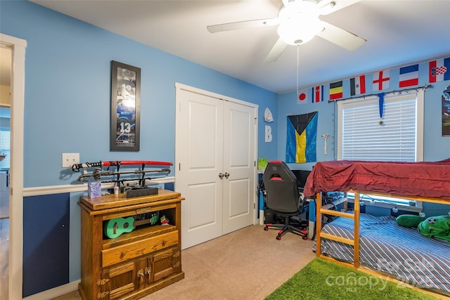 carpeted bedroom featuring ceiling fan