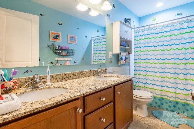 bathroom featuring vanity, toilet, curtained shower, and tile patterned flooring