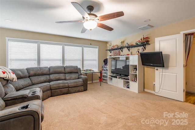 living room with light carpet and ceiling fan