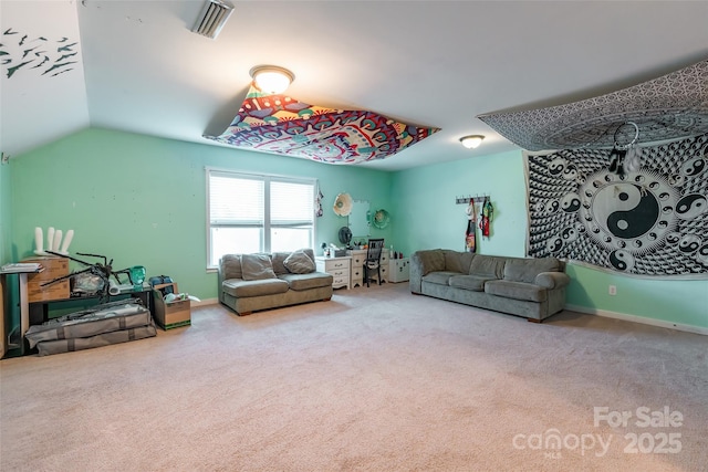 living room with vaulted ceiling and carpet flooring