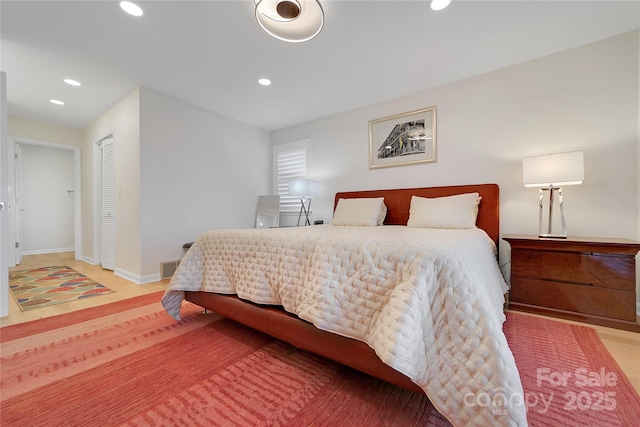 bedroom with recessed lighting and baseboards