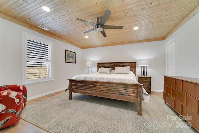bedroom featuring wood ceiling, recessed lighting, baseboards, light wood finished floors, and crown molding