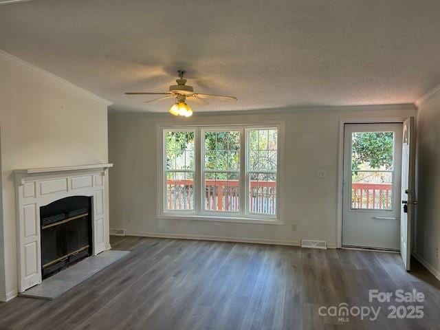 unfurnished living room featuring a textured ceiling, ceiling fan, and dark hardwood / wood-style floors