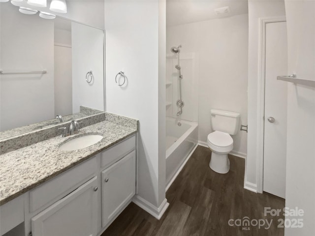 full bathroom featuring hardwood / wood-style floors, toilet, vanity, and shower / bath combination