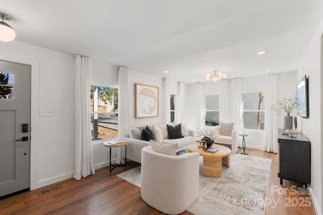 living room with dark hardwood / wood-style flooring