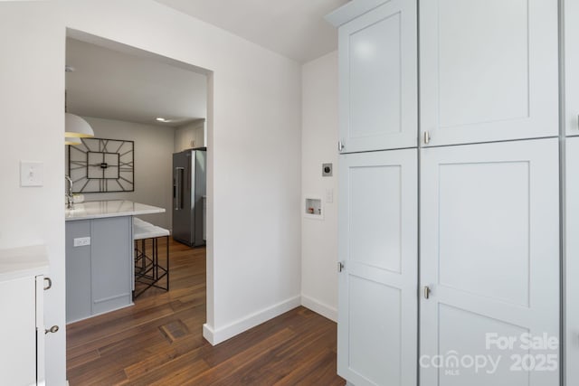 hallway with dark wood-type flooring