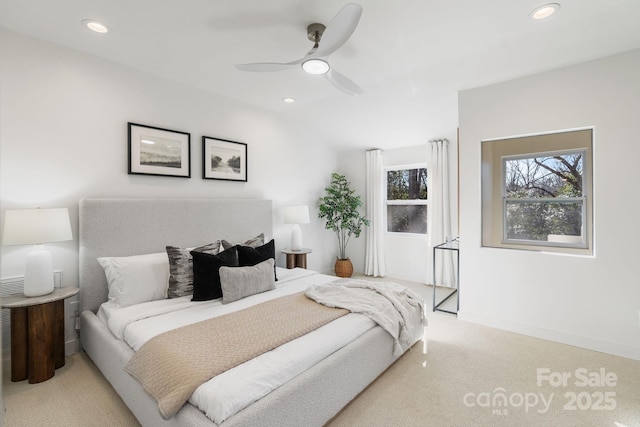 carpeted bedroom with lofted ceiling and ceiling fan