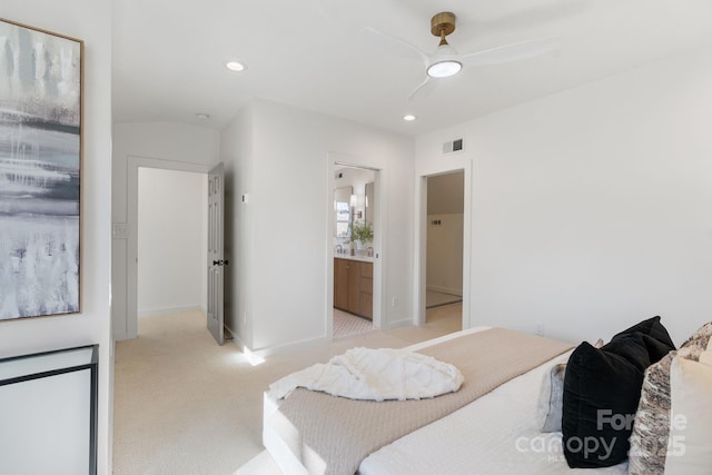 carpeted bedroom featuring ceiling fan and connected bathroom