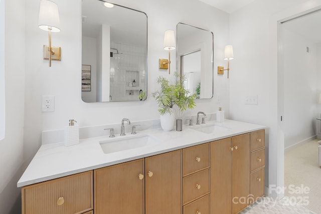 bathroom with a shower and vanity