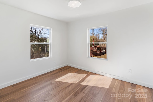 empty room featuring hardwood / wood-style floors