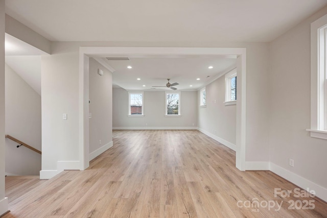 spare room with recessed lighting, light wood-style floors, and baseboards