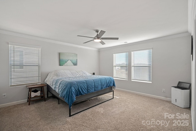 carpeted bedroom featuring ceiling fan and ornamental molding