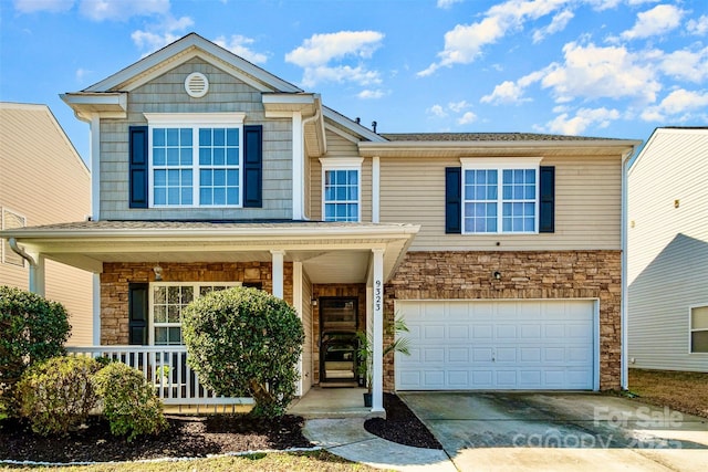 view of front of property with a garage and a porch