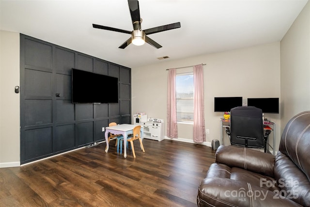 living room featuring ceiling fan and wood-type flooring