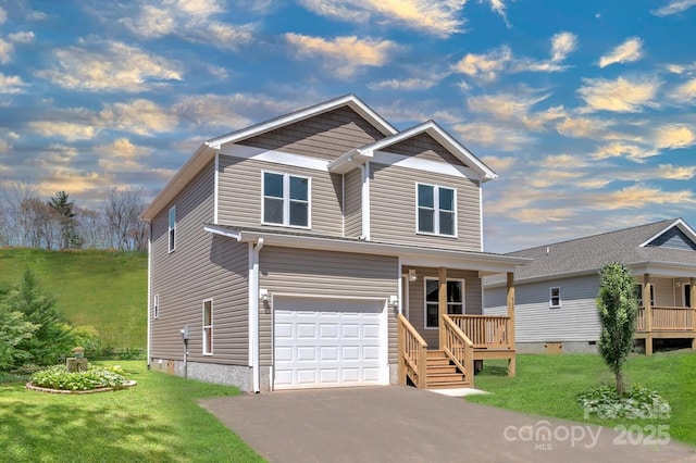 view of front of house featuring covered porch, a front yard, and a garage