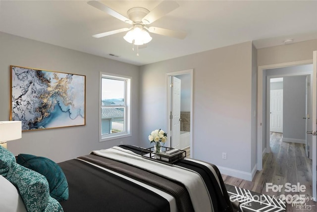 bedroom featuring ceiling fan, connected bathroom, and wood-type flooring