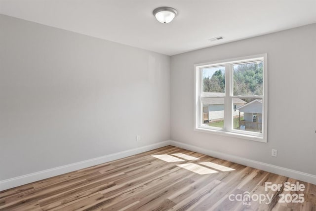 unfurnished room featuring light wood-type flooring