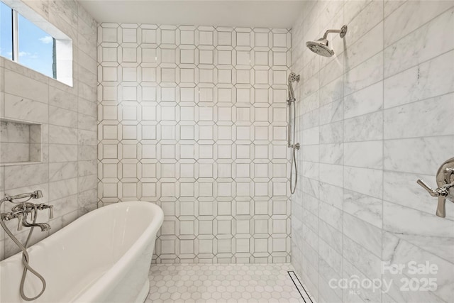 bathroom with tile walls and independent shower and bath