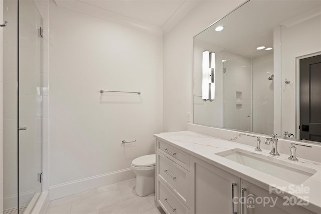 bathroom with toilet, ornamental molding, walk in shower, and vanity