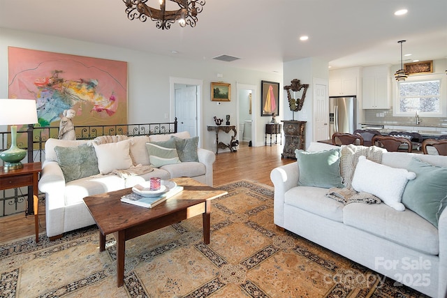 living room with light hardwood / wood-style floors