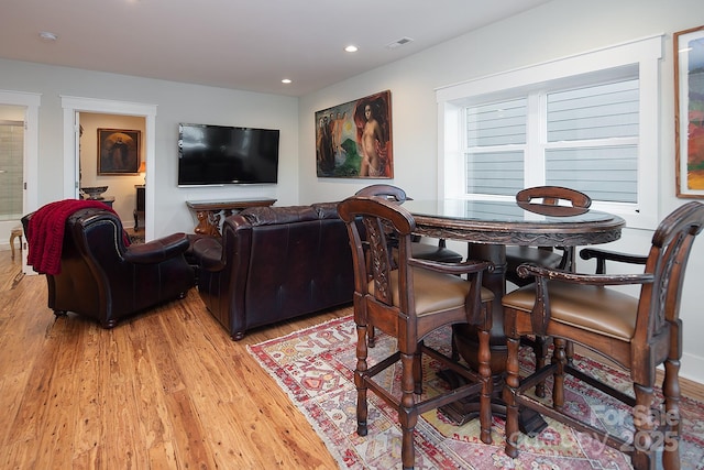 dining area with light hardwood / wood-style flooring