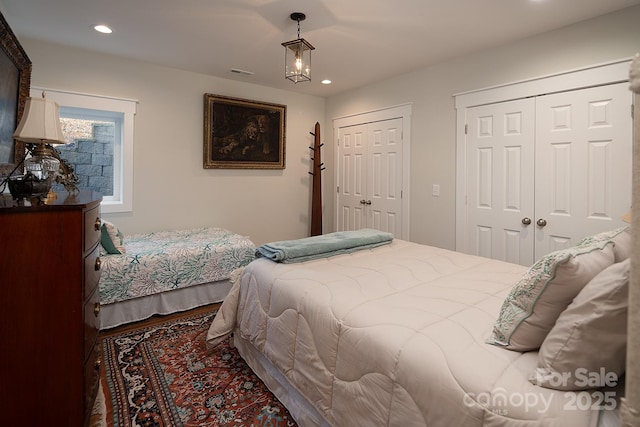 bedroom with two closets