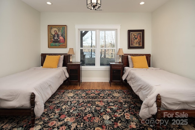 bedroom featuring dark hardwood / wood-style flooring