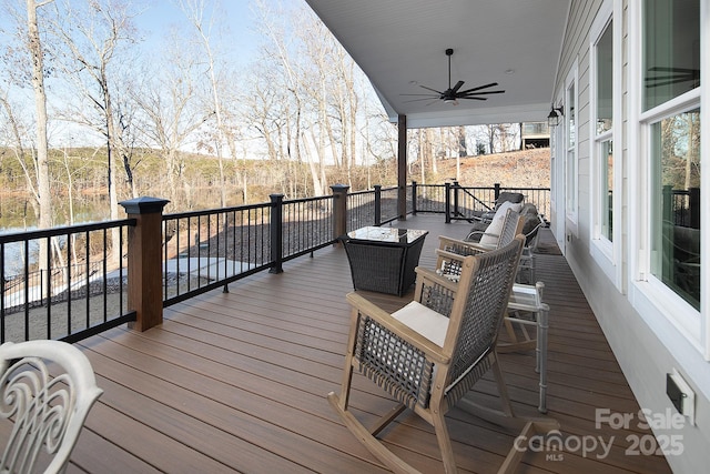 wooden deck featuring ceiling fan