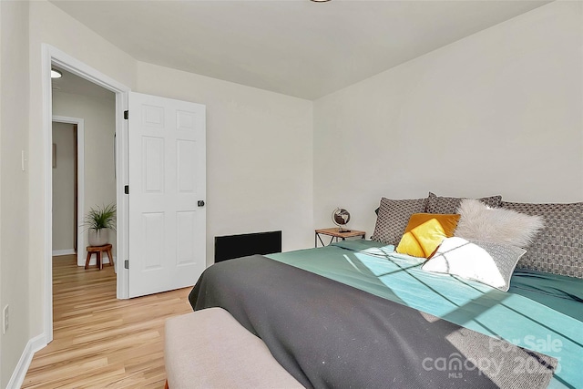 bedroom with light wood-type flooring