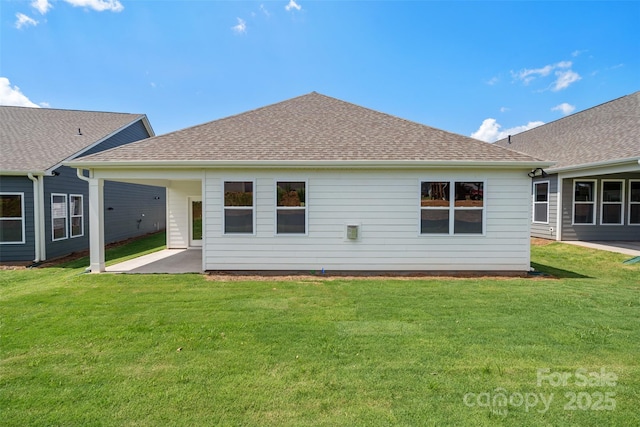 rear view of house with a patio and a lawn