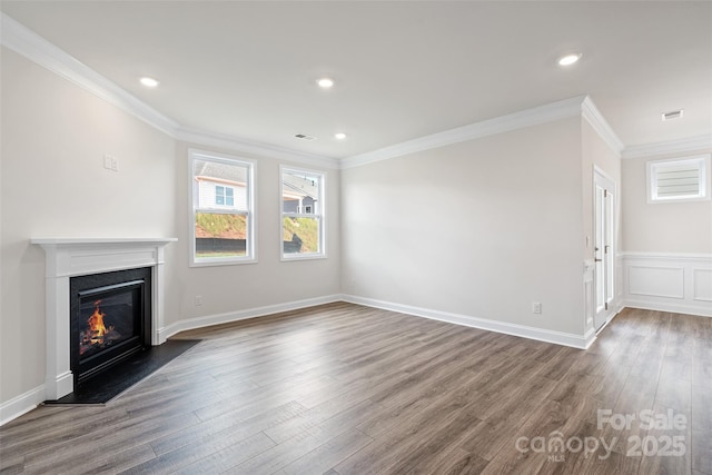 unfurnished living room with ornamental molding and dark wood-type flooring