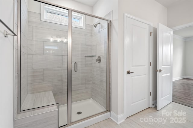 bathroom featuring walk in shower and tile patterned floors