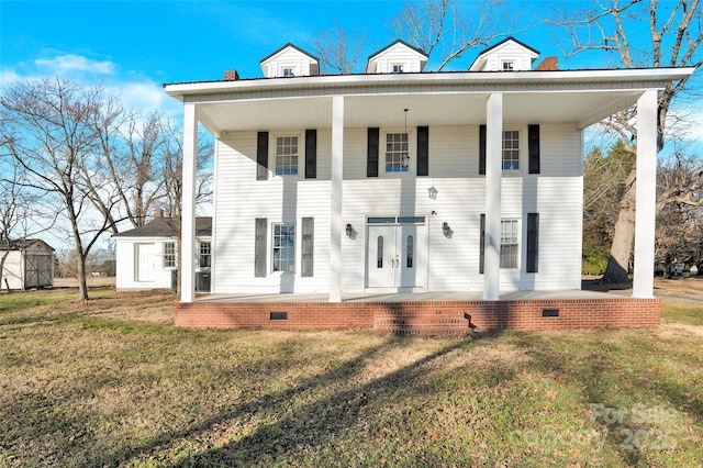 view of front of house with a front lawn and a porch