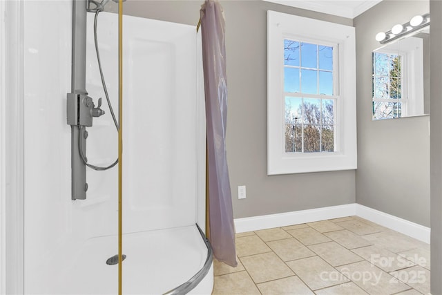 bathroom featuring crown molding, tile patterned floors, and walk in shower