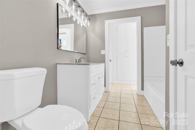 bathroom with toilet, tile patterned flooring, ornamental molding, and vanity