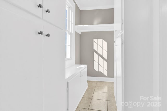 bathroom with a wealth of natural light and tile patterned floors