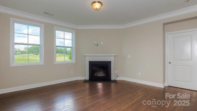 unfurnished living room with ornamental molding and dark hardwood / wood-style floors