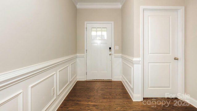 entryway with dark hardwood / wood-style flooring and crown molding