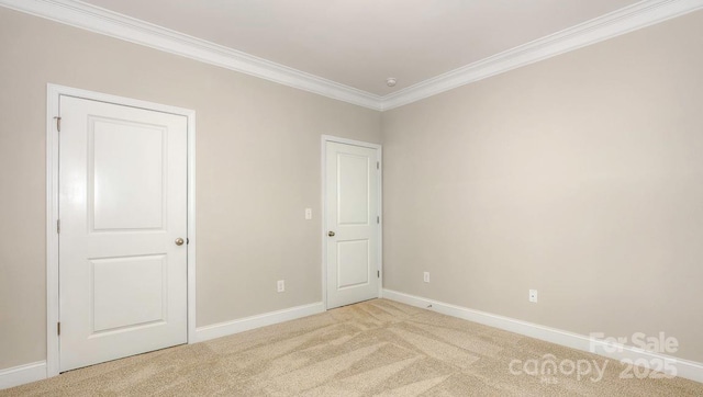 carpeted empty room with ornamental molding